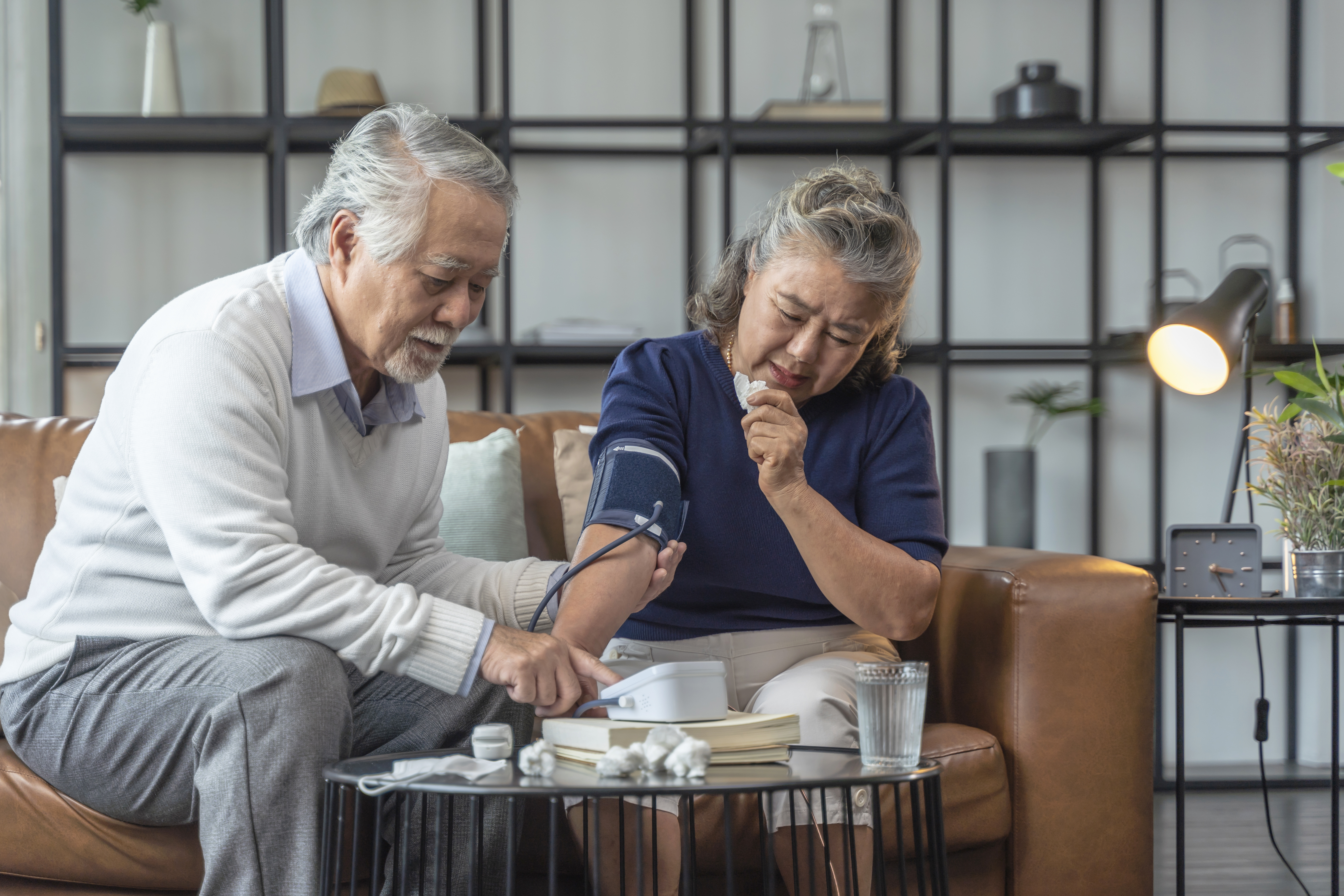 grandfather-hand-use-digital-measuring-blood-pressure-home-with-portable-device-checking-grandmotherasian-couple-checking-blood-pressure-home